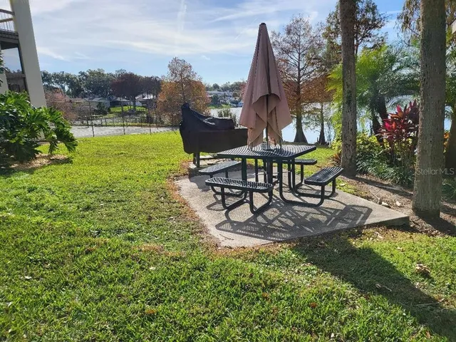 a view of a swimming pool with a table and chairs