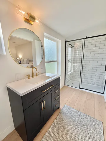 a view of a room with wooden floor and cabinet