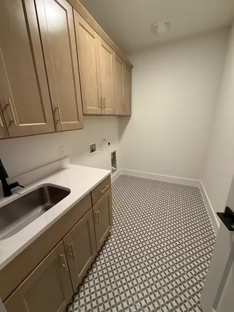 a kitchen with a sink and cabinets