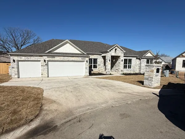 a front view of a house with a outdoor space