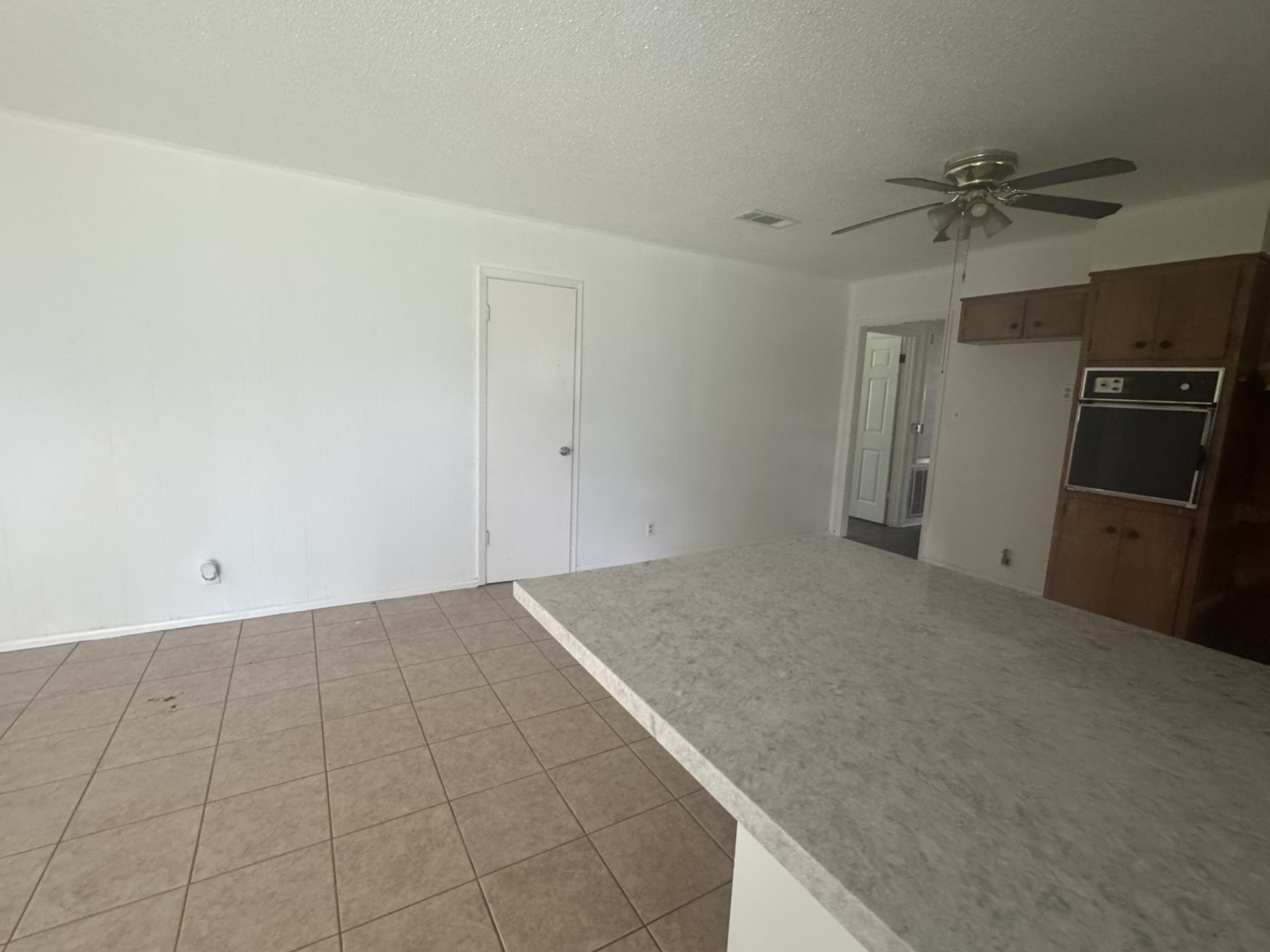 706 University Avenue Wharton, TX 77488 - Photo 11 of 29 a view of a kitchen with a sink and a refrigerator