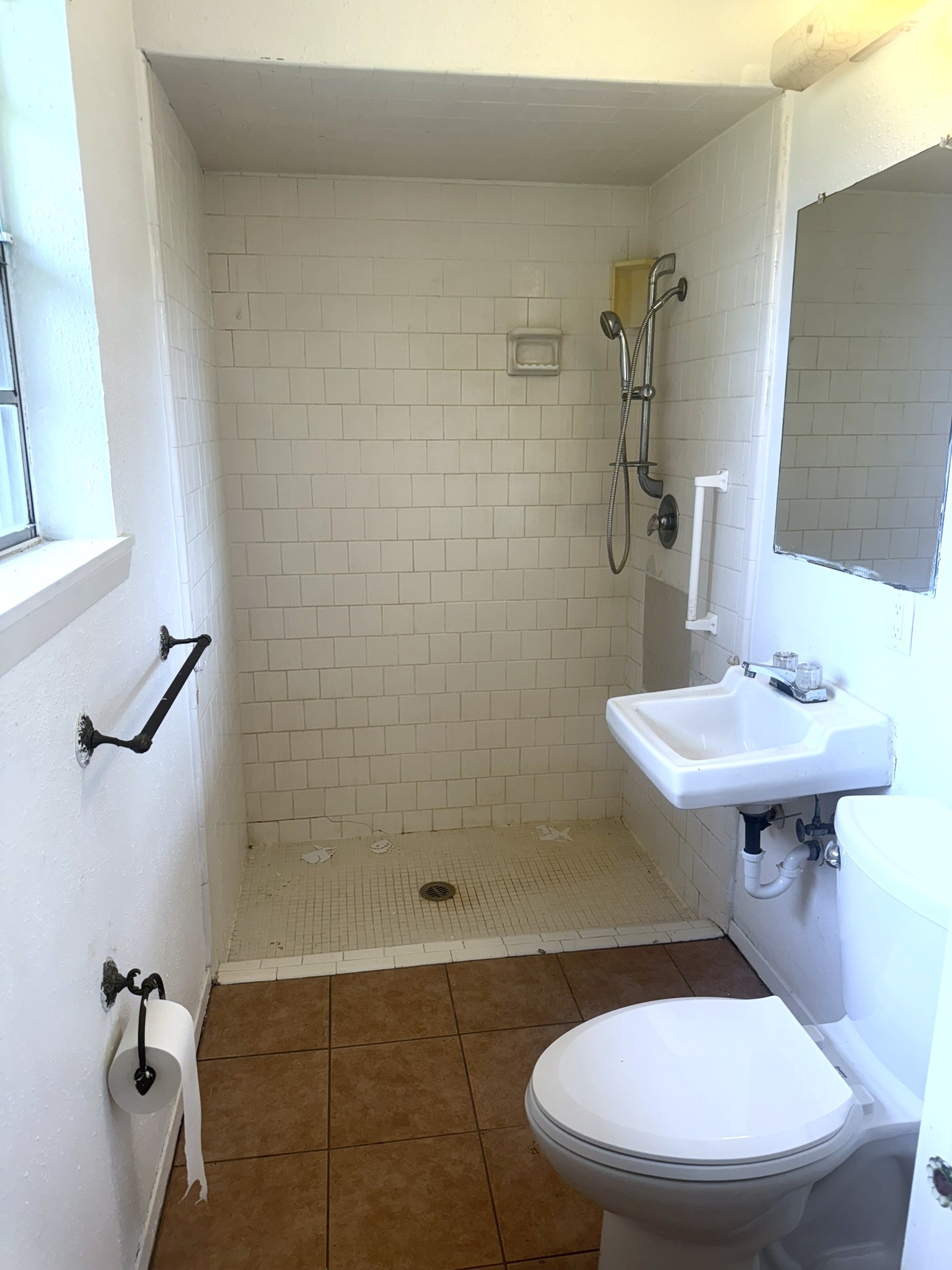 706 University Avenue Wharton, TX 77488 - Photo 20 of 29 a bathroom with a sink toilet and a mirror