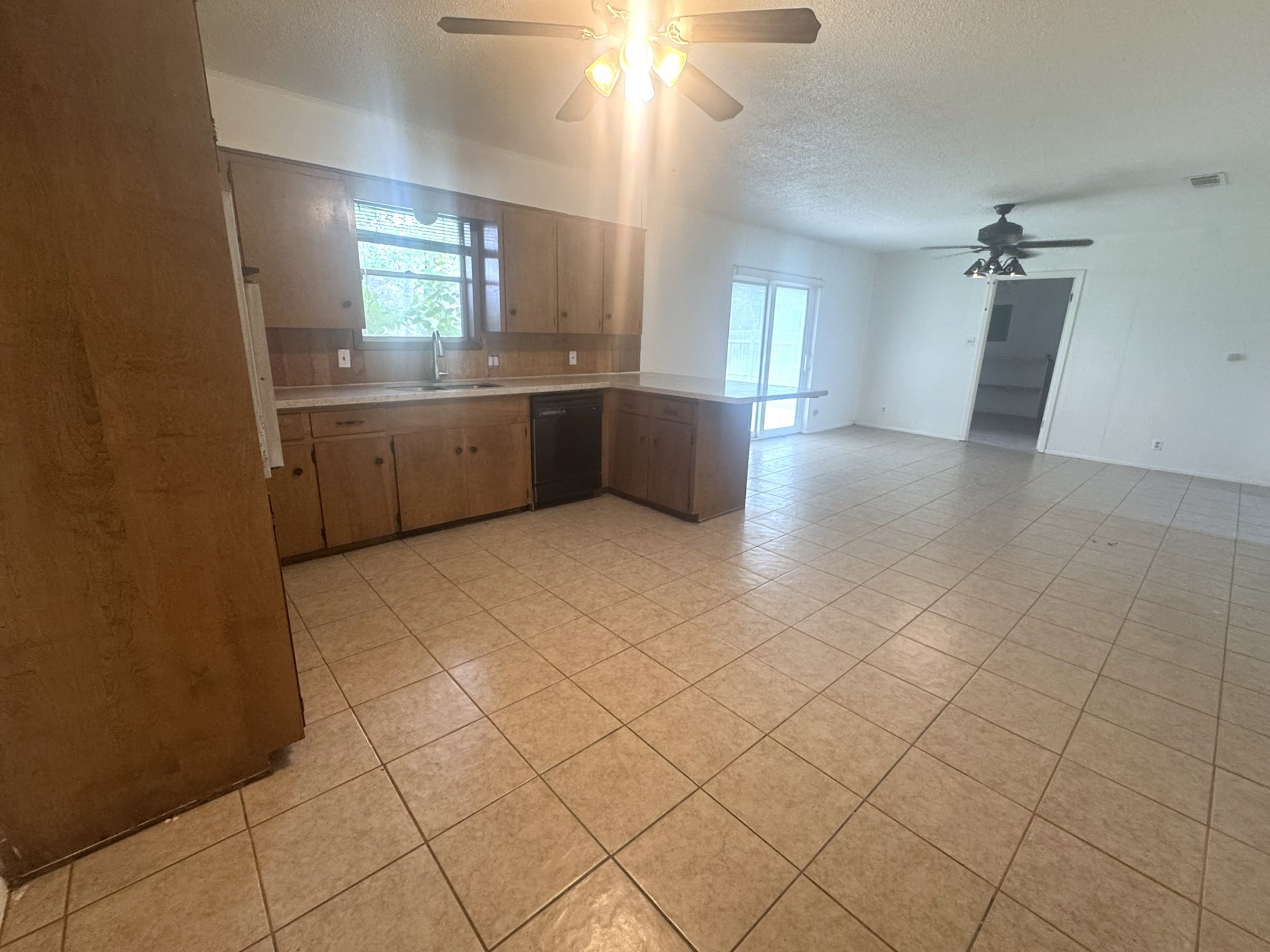 706 University Avenue Wharton, TX 77488 - Photo 7 of 29 a view of a kitchen with a sink and a mirror