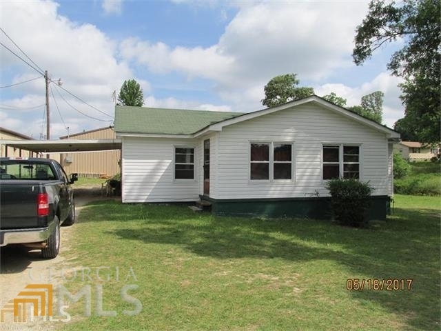 70 School Road Hampton, GA 30228 - Photo 1 of 1 a view of a house with a yard