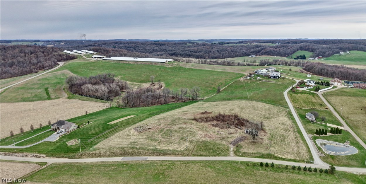 10316 Lower Trail Road Northwest Dundee, OH 44624 - Photo 1 of 10 Overview of rural landscape featuring a heavily wooded area