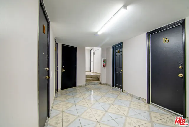 a bedroom with a bed and a closet