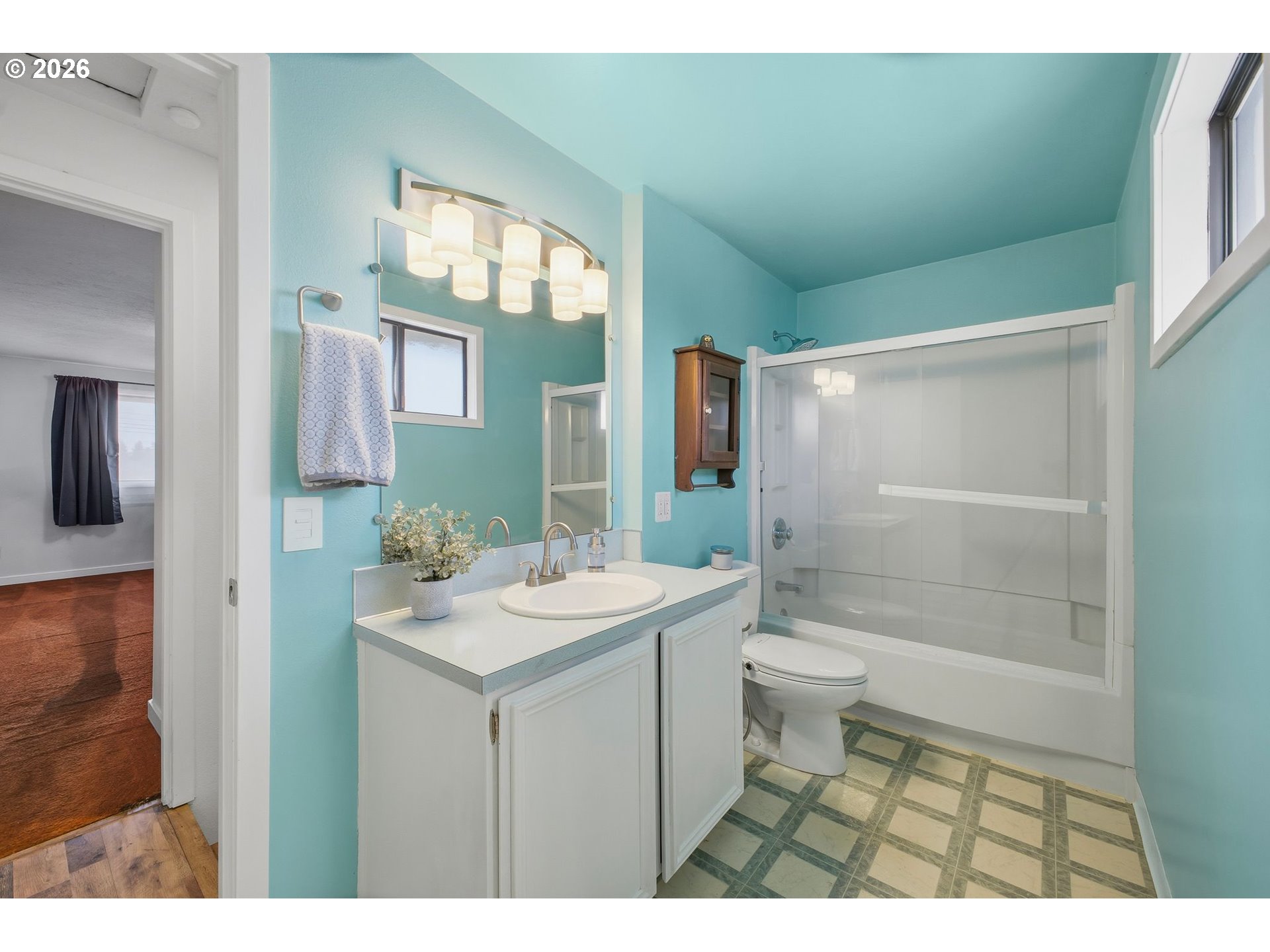 21858 Southwest Regal Court Beaverton, OR 97003 - Photo 21 of 29 a bathroom with a sink a toilet and shower