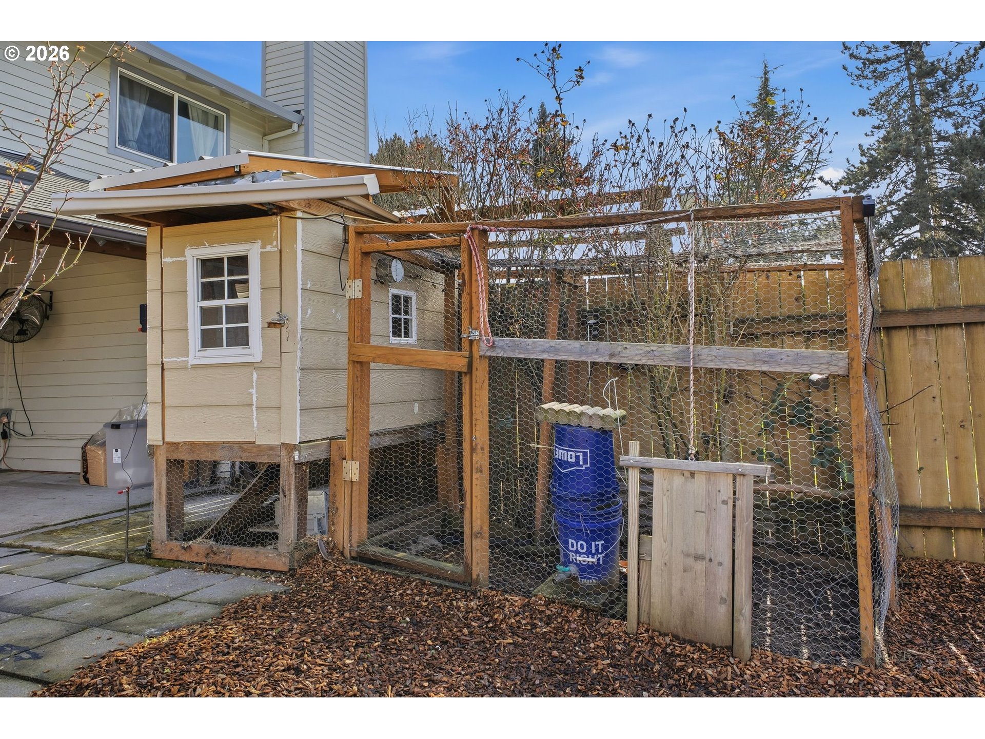 21858 Southwest Regal Court Beaverton, OR 97003 - Photo 26 of 29 a backyard of a house with table and chairs