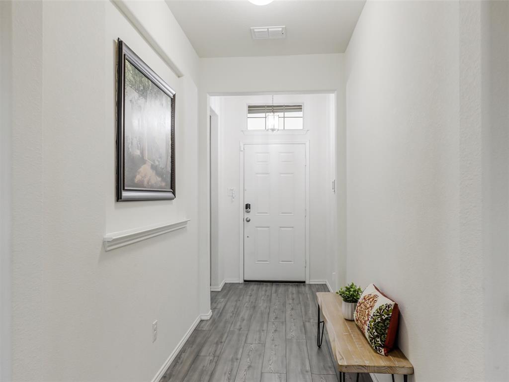 4517 Ashmark Road Aubrey, TX 76227 - Photo 4 of 26 a view of an entryway with wooden floor