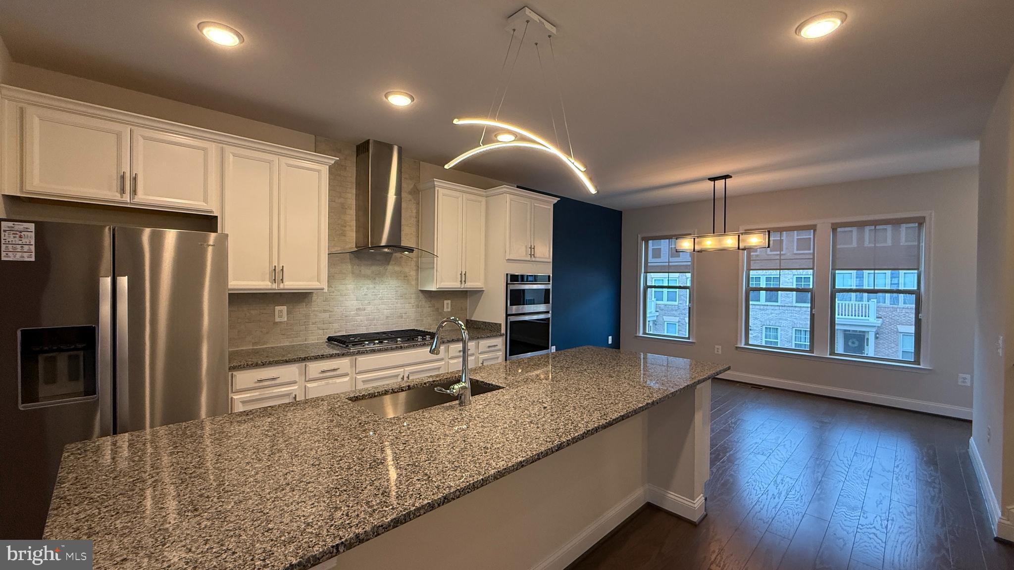 1949 Greenbriar Hall Road Dumfries, VA 22026 - Photo 2 of 26 a kitchen with stainless steel appliances granite countertop a sink a stove and a refrigerator