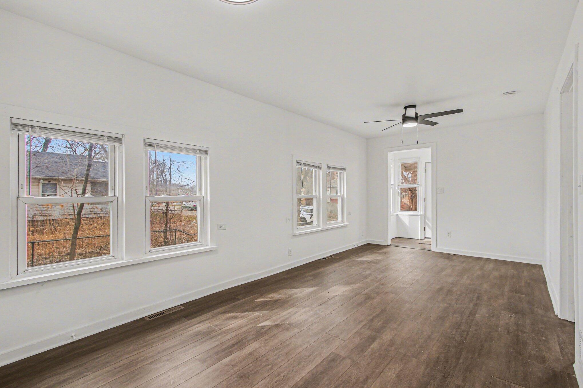 4471 Massachusetts Street Gary, IN 46409 - Photo 12 of 24 a view of an empty room with a window and wooden floor