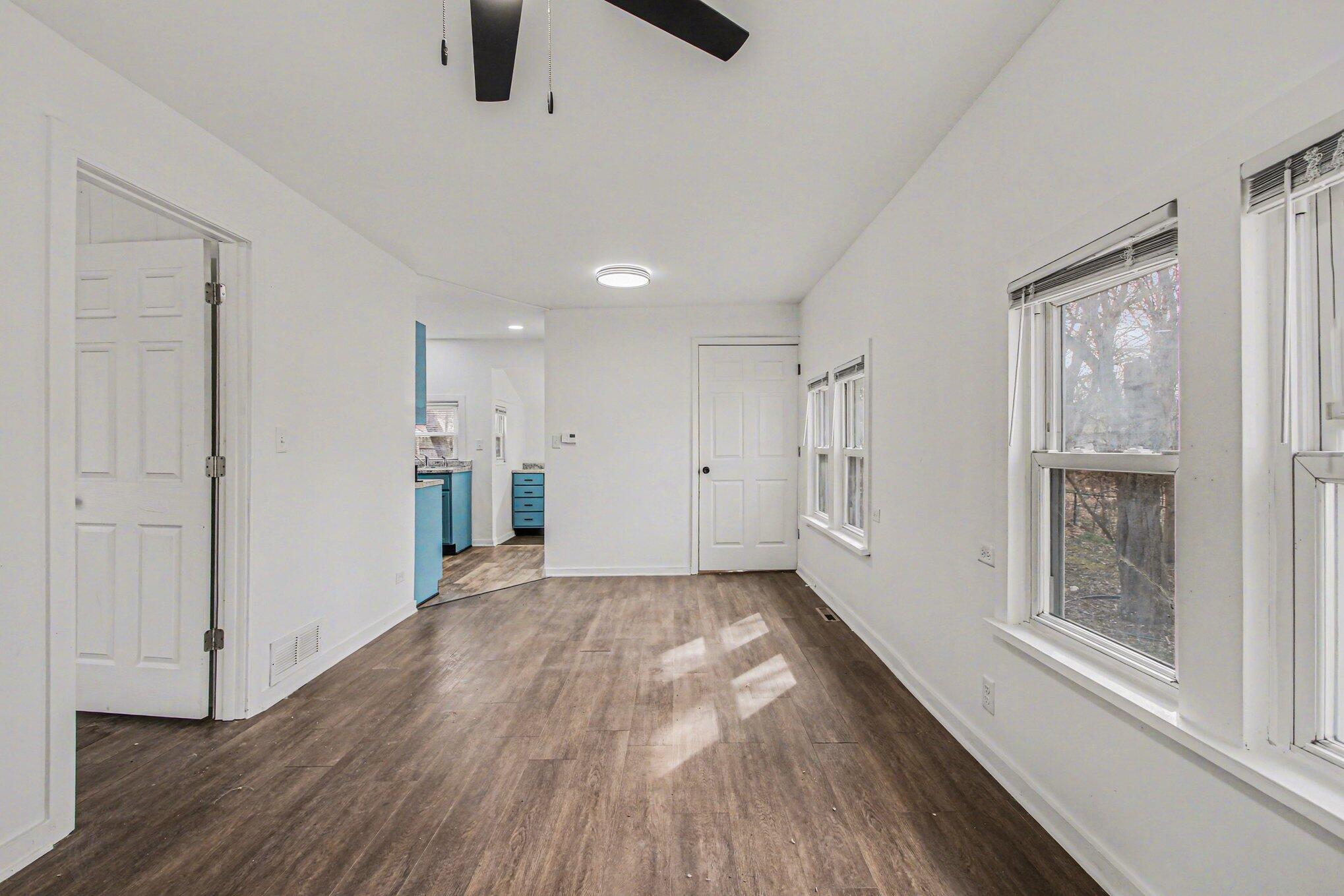 4471 Massachusetts Street Gary, IN 46409 - Photo 14 of 24 a view of an empty room with a window and wooden floor