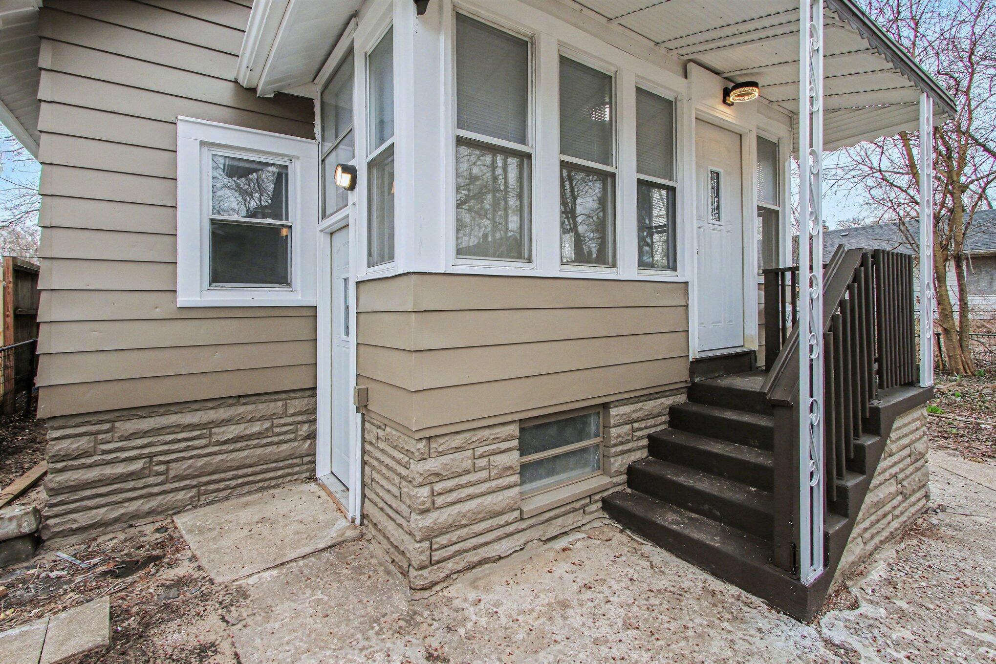4471 Massachusetts Street Gary, IN 46409 - Photo 2 of 24 a view of a house with a door and a window