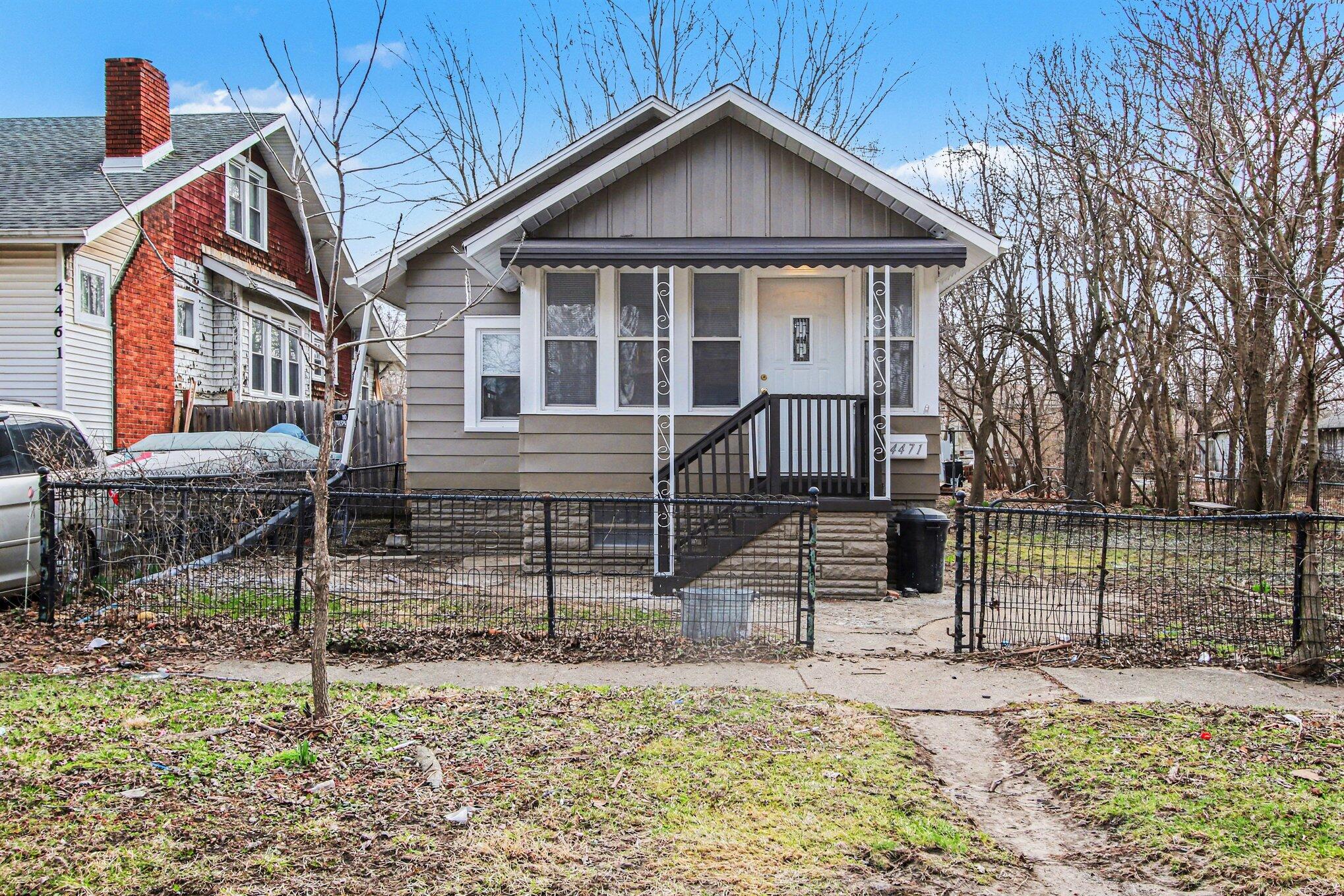 4471 Massachusetts Street Gary, IN 46409 - Photo 21 of 24 a front view of a house with garden
