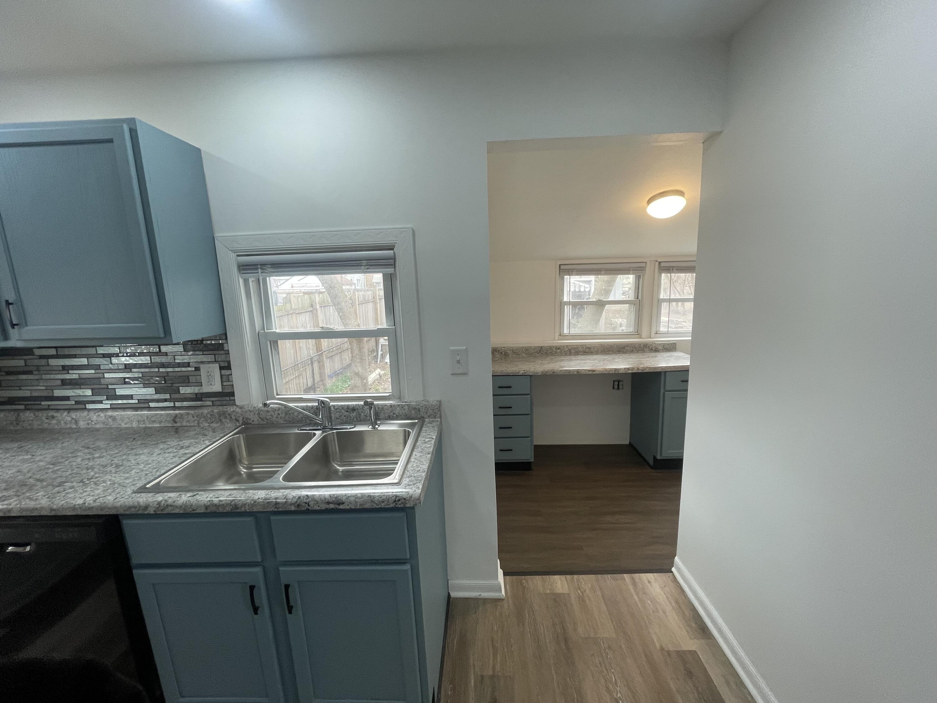 4471 Massachusetts Street Gary, IN 46409 - Photo 9 of 24 a kitchen with a sink and cabinets