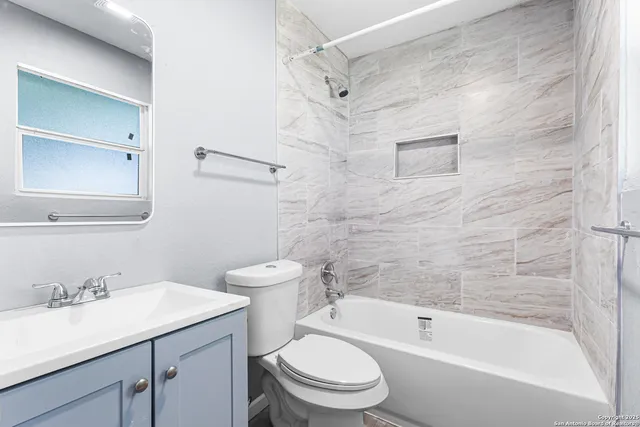 a bathroom with a sink a toilet and a bathtub
