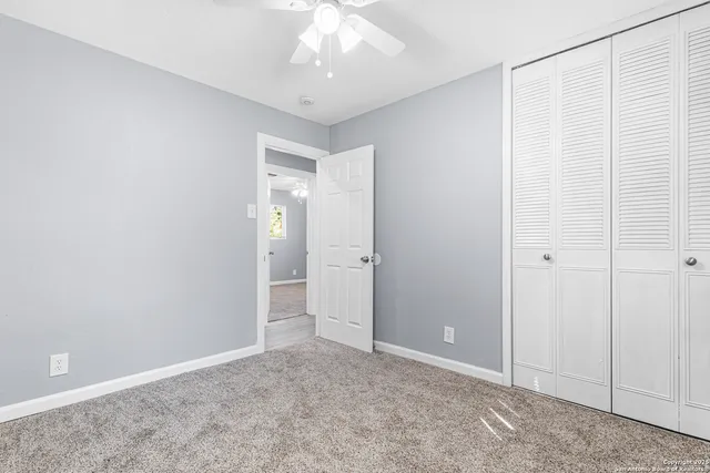 an empty room with an entryway door