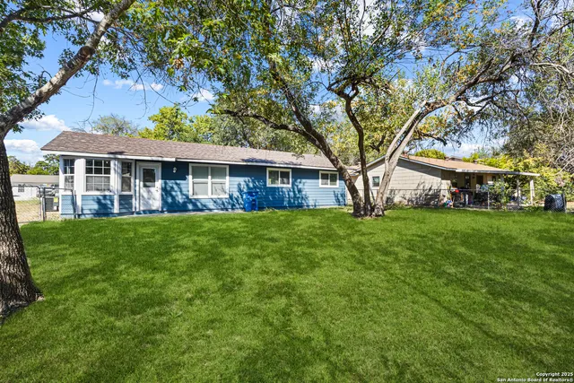 a view of house with a garden