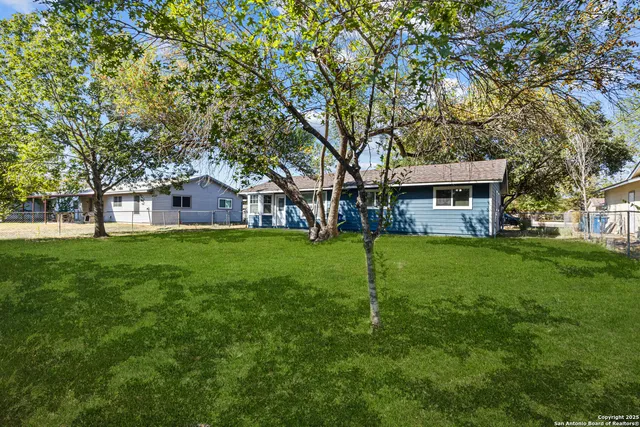 a house view with a garden space