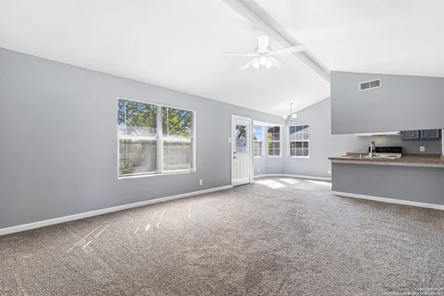 a view of an empty room with a window