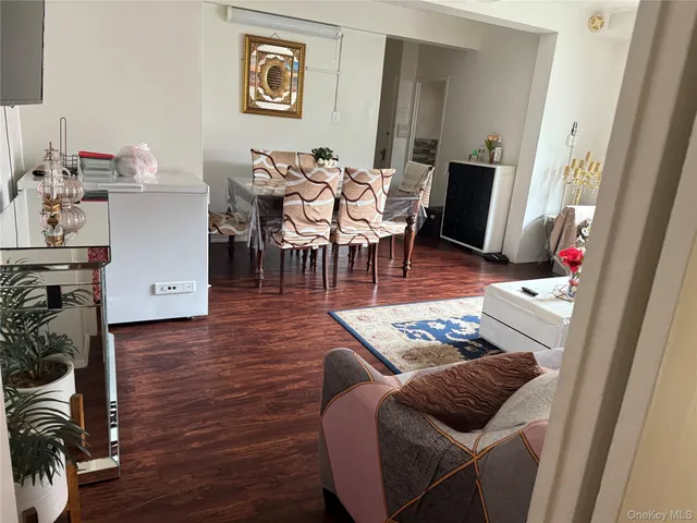 a living room with furniture rug and window