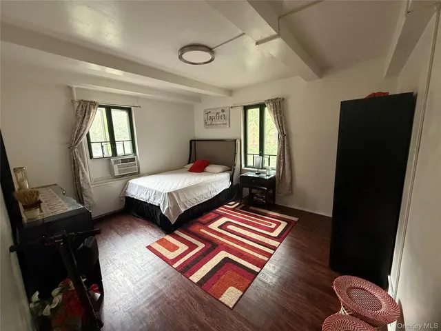 a bedroom with bed and window