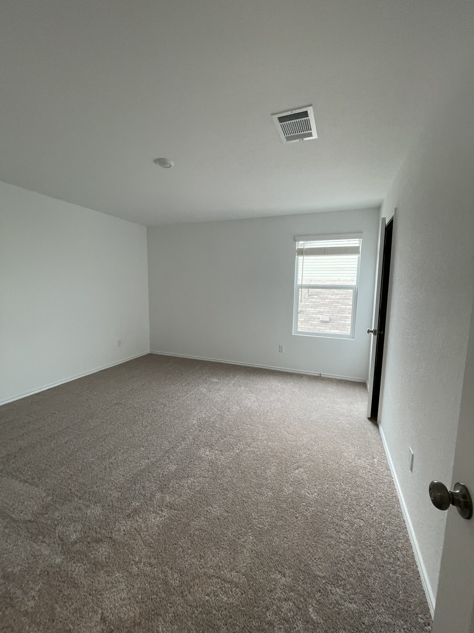 1121 Largemouth Lane Bastrop, TX 78602 - Photo 9 of 13 an empty room with a window