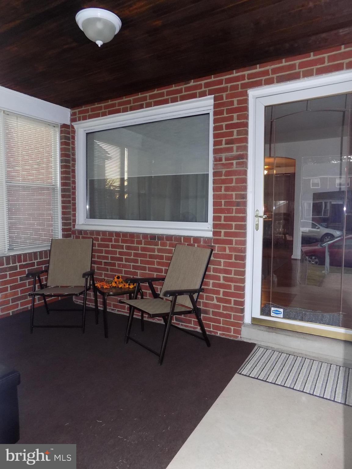 2750 Moorgate Road Baltimore, MD 21222 - Photo 2 of 27 Quiet place to relax on the enclosed porch