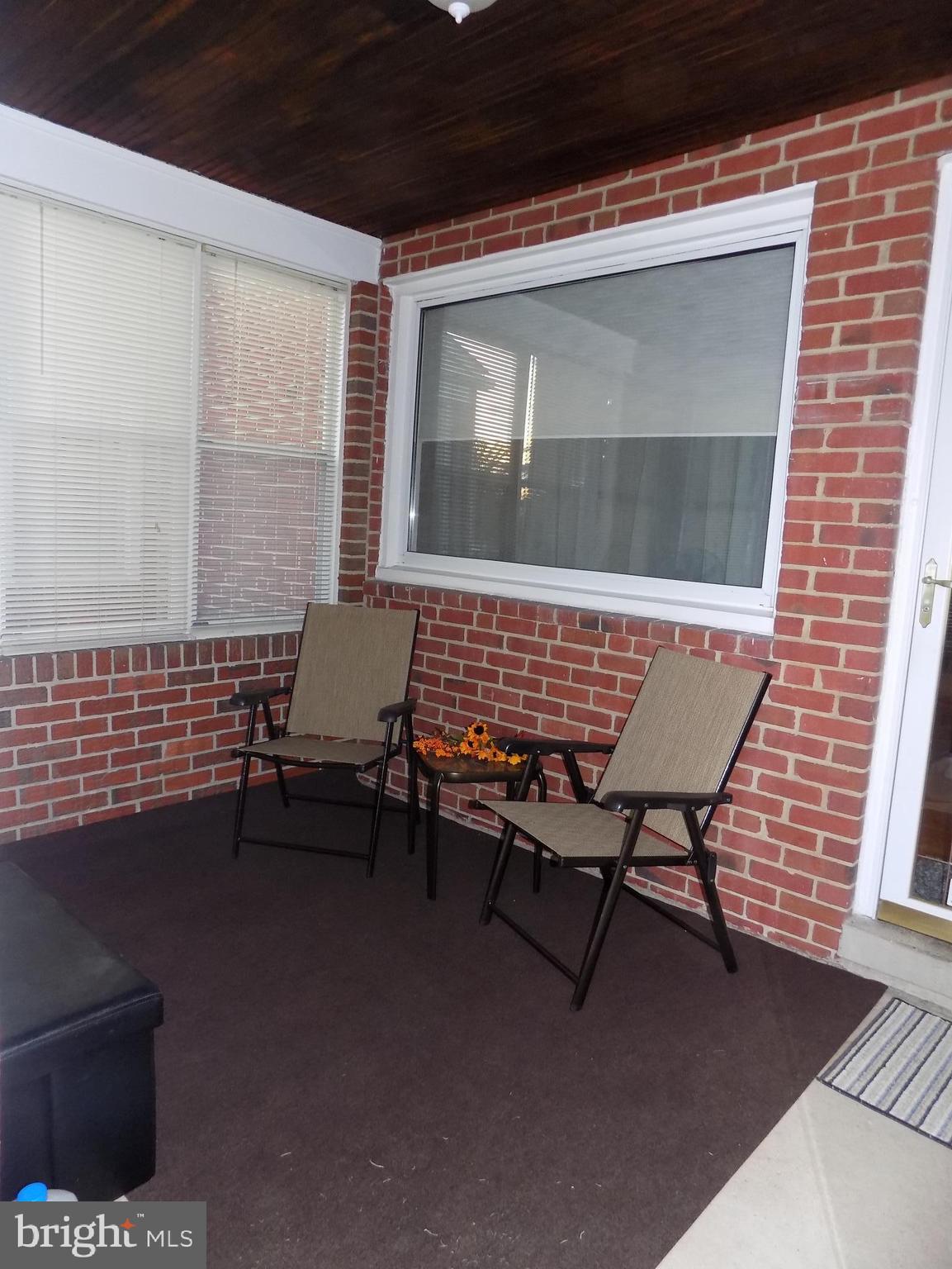 2750 Moorgate Road Baltimore, MD 21222 - Photo 3 of 27 Enclosed front porch w/ windows