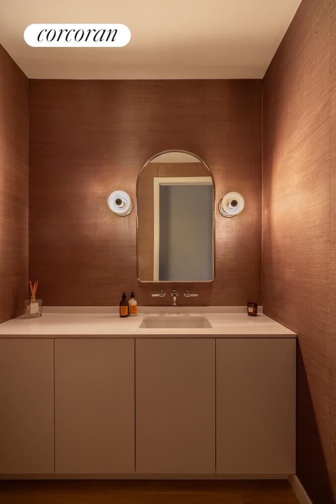 72 Mercer Street, Unit 5W Manhattan, NY 10012 - Photo 11 of 17 a bathroom with a sink and a mirror