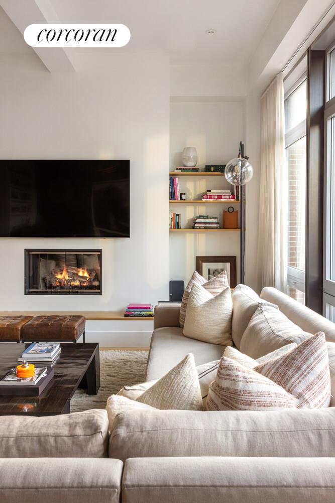 72 Mercer Street, Unit 5W Manhattan, NY 10012 - Photo 4 of 17 a living room with furniture and a flat screen tv