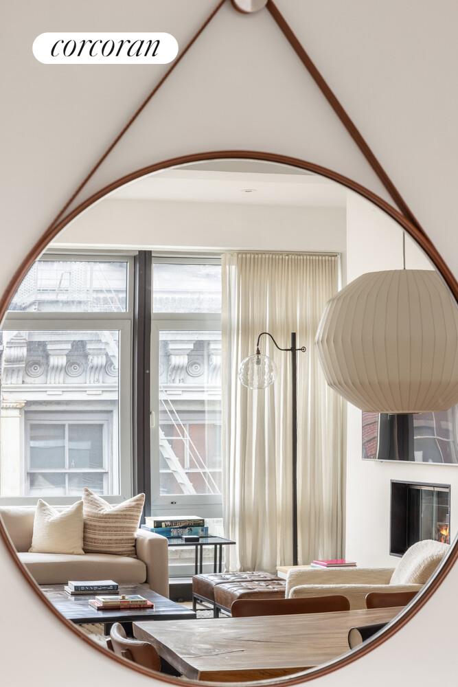 72 Mercer Street, Unit 5W Manhattan, NY 10012 - Photo 8 of 17 a dining room with table and chairs