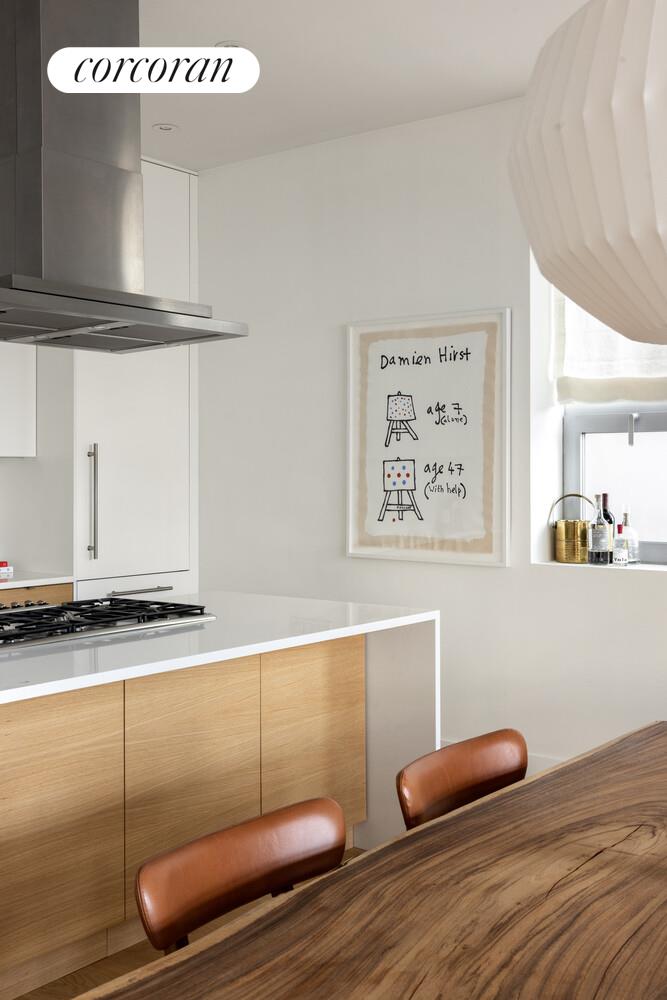 72 Mercer Street, Unit 5W Manhattan, NY 10012 - Photo 9 of 17 a room with furniture and a wooden floor