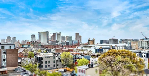 a view of city and a tall buildings