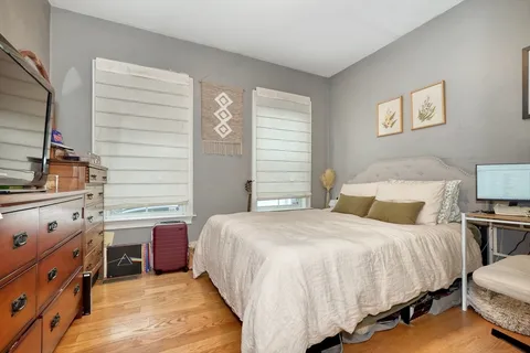 a bedroom with a bed and a cabinets