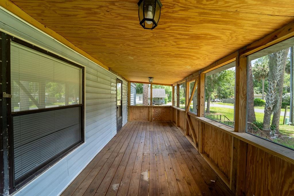 24031 Armadillo Road Astor, FL 32102 - Photo 5 of 43 a view of a balcony with wooden floor