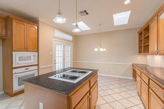 a kitchen that has a stove and a sink
