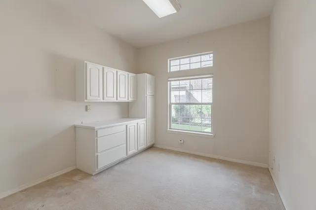 an empty room with windows