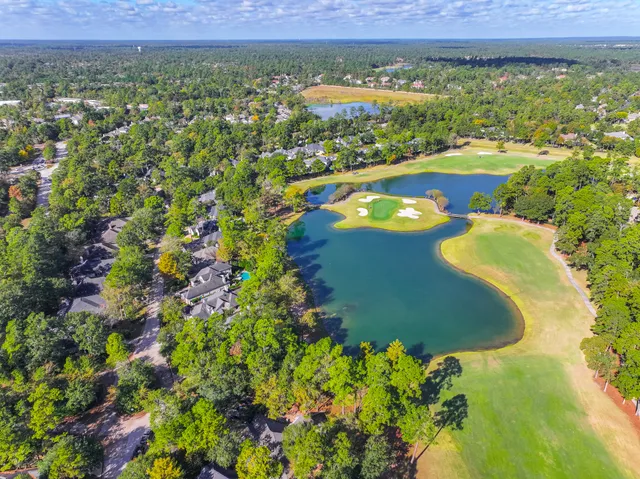 a view of a lake with a yard