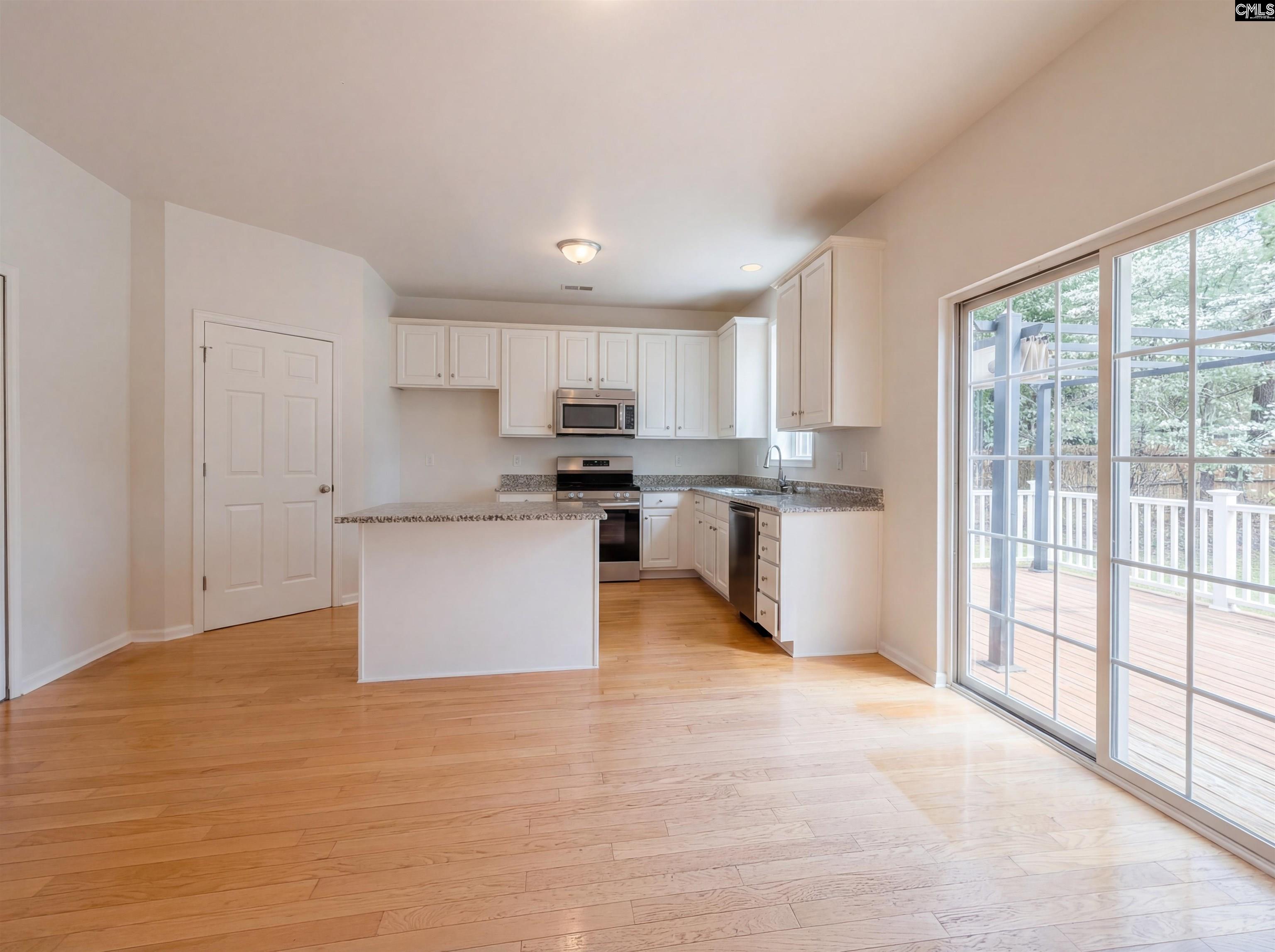 112 Coopers Hawk Circle Irmo, SC 29063 - Photo 19 of 26 a large kitchen with cabinets and a window