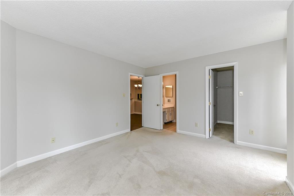 1606 Sharon Road West, Unit 34 Charlotte, NC 28210 - Photo 14 of 18 an empty room with closet area