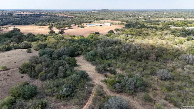 a view of a lake with trees all around