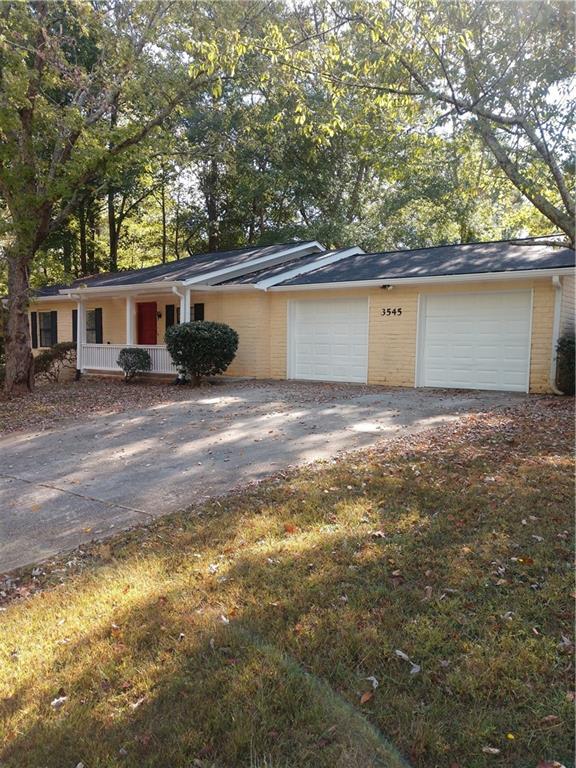 3545 Jackson Drive Decatur, GA 30032 - Photo 1 of 1 a view of a house with a yard and large tree