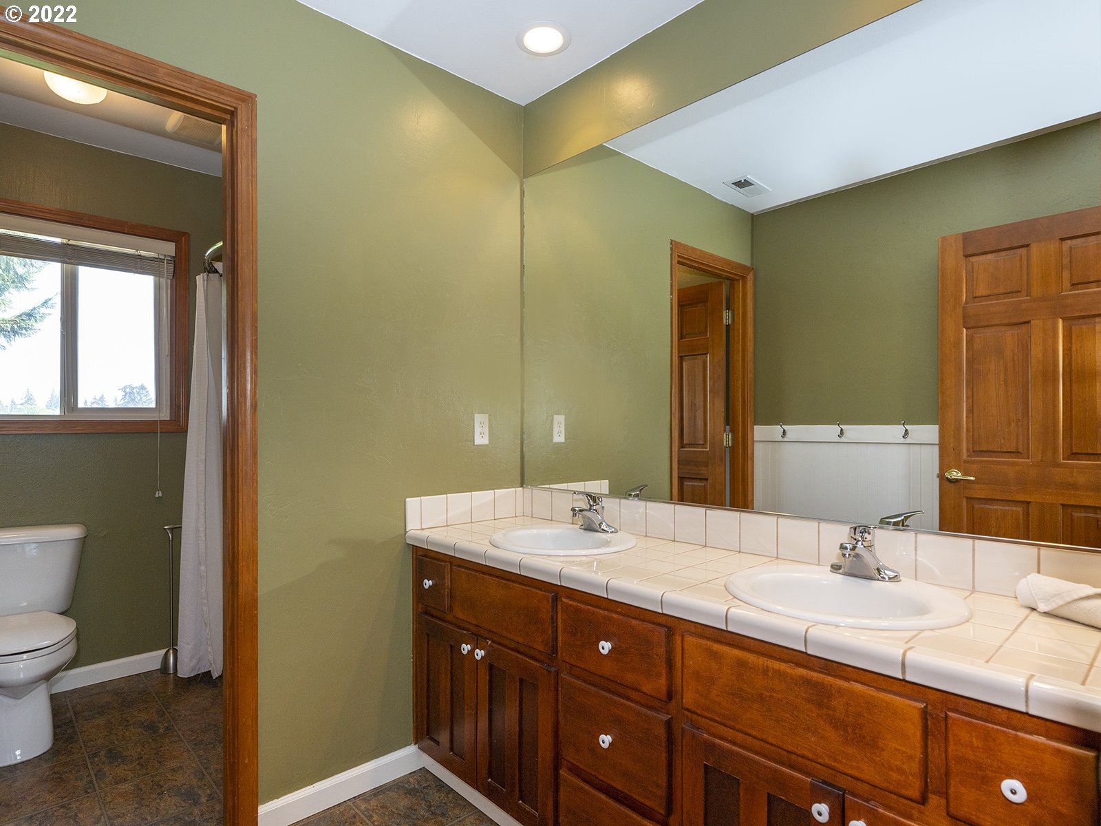 2286 South 31st Court Ridgefield, WA 98642 - Photo 20 of 31 a bathroom with a granite countertop sink mirror and toilet