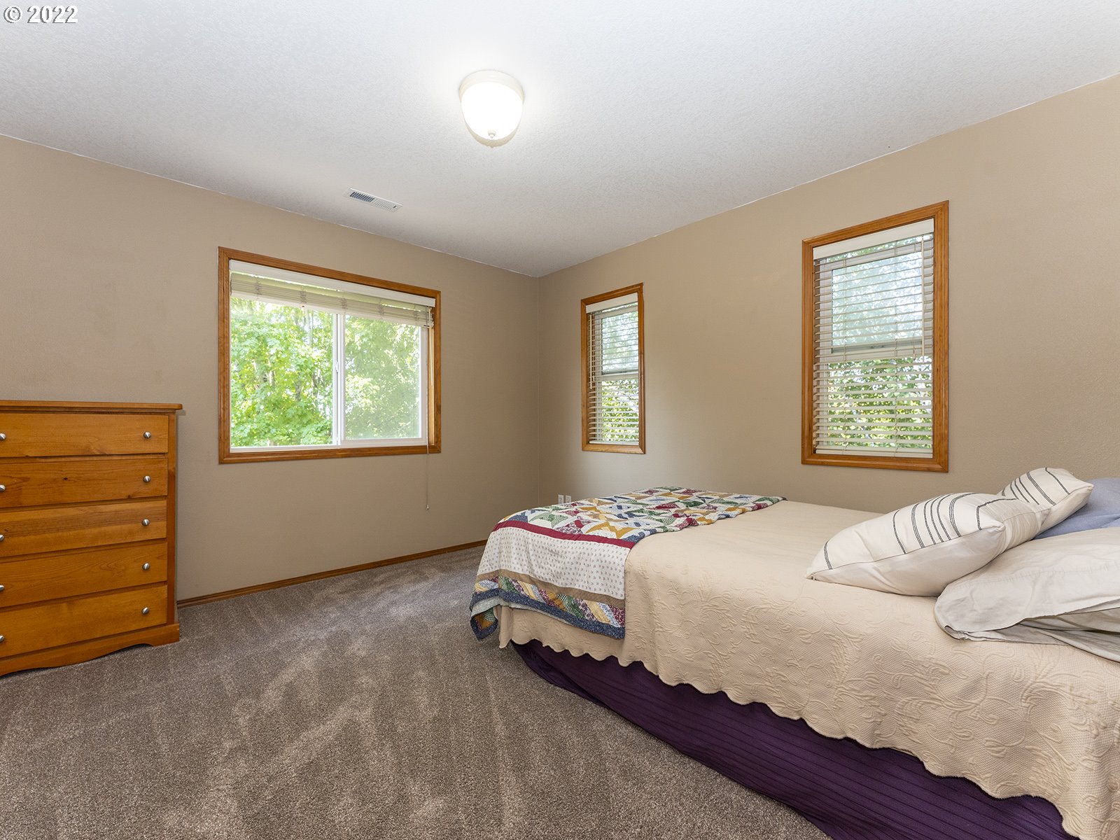 2286 South 31st Court Ridgefield, WA 98642 - Photo 21 of 31 a bedroom with a bed and a window