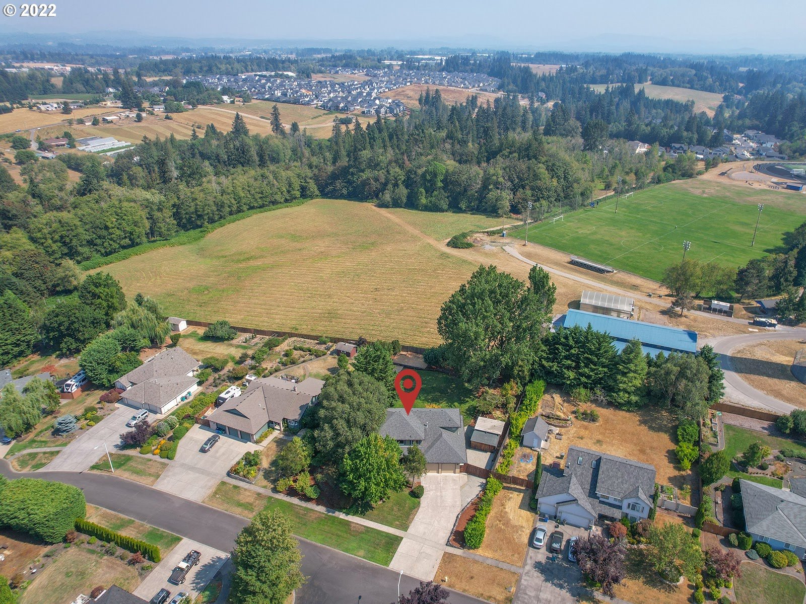 2286 South 31st Court Ridgefield, WA 98642 - Photo 27 of 31 an aerial view of residential houses with outdoor space and trees