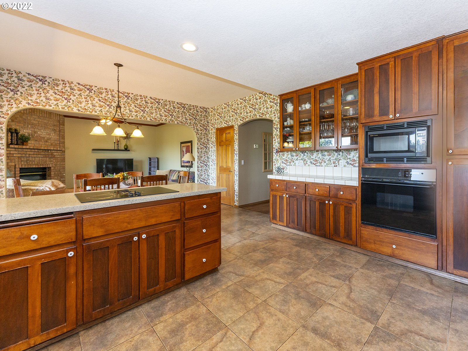 2286 South 31st Court Ridgefield, WA 98642 - Photo 10 of 31 a large kitchen with stainless steel appliances granite countertop a stove a sink and a microwave