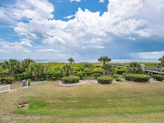 a view of a lake with a yard