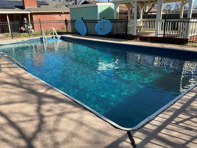 a view of swimming pool from a balcony