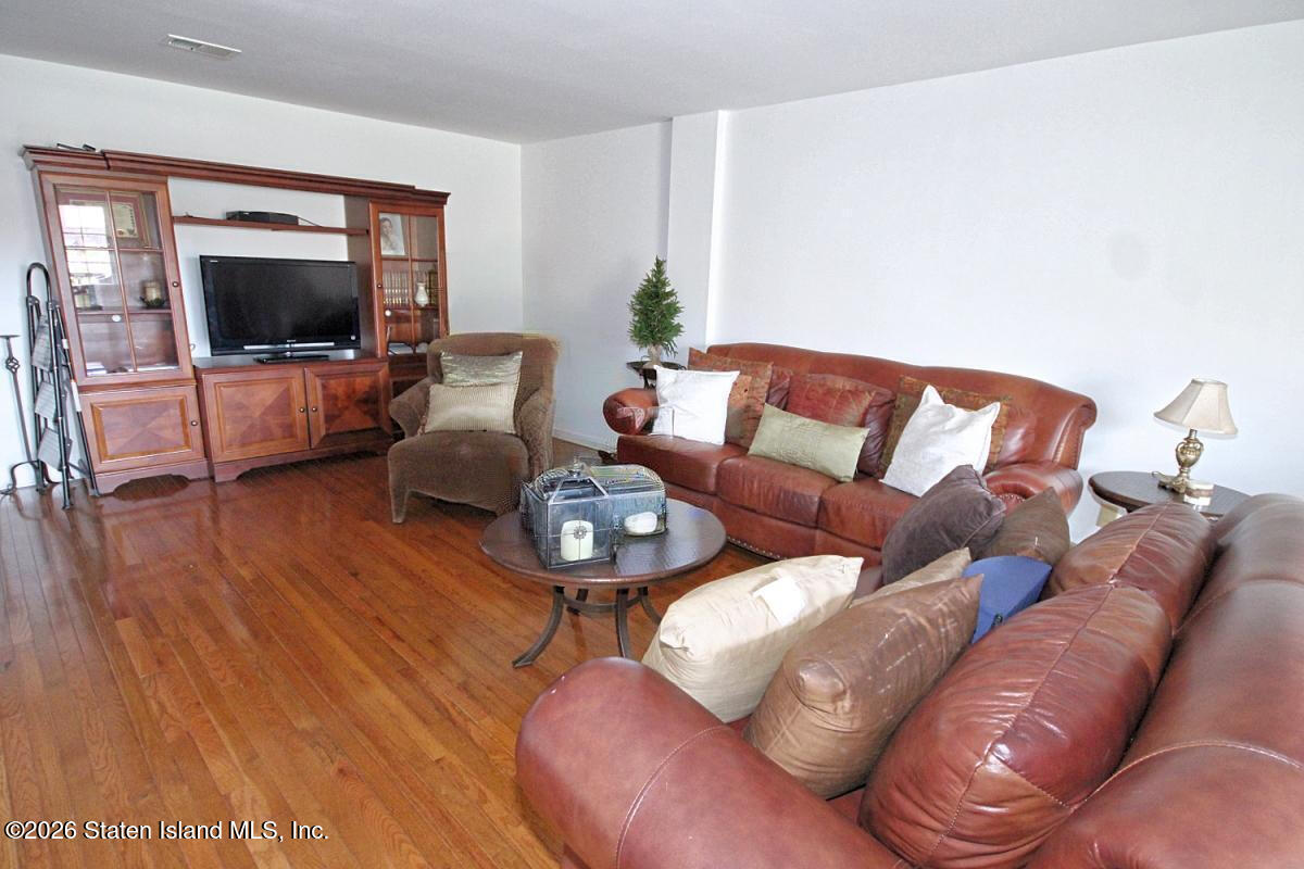 951 West Fingerboard Road Staten Island, NY 10304 - Photo 22 of 29 a living room with furniture and a flat screen tv
